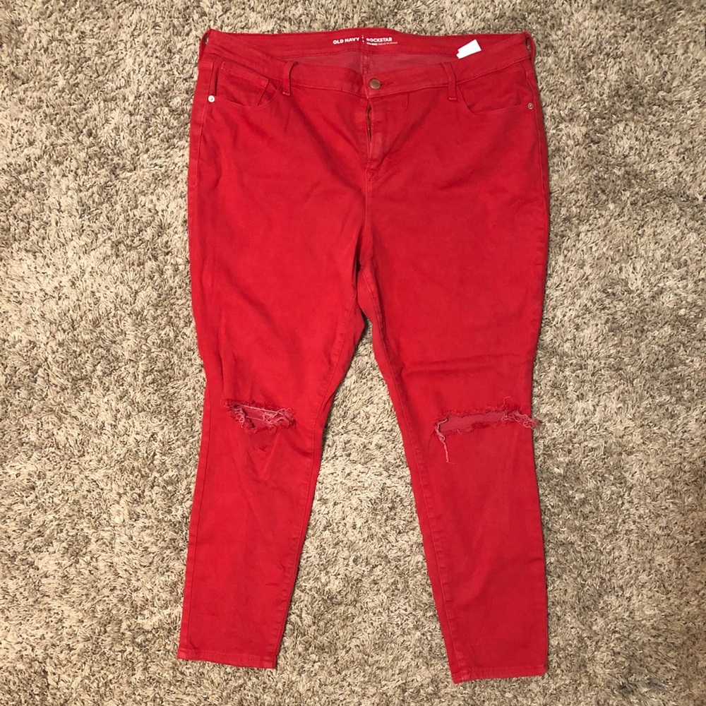 Red skinny jeans with holes